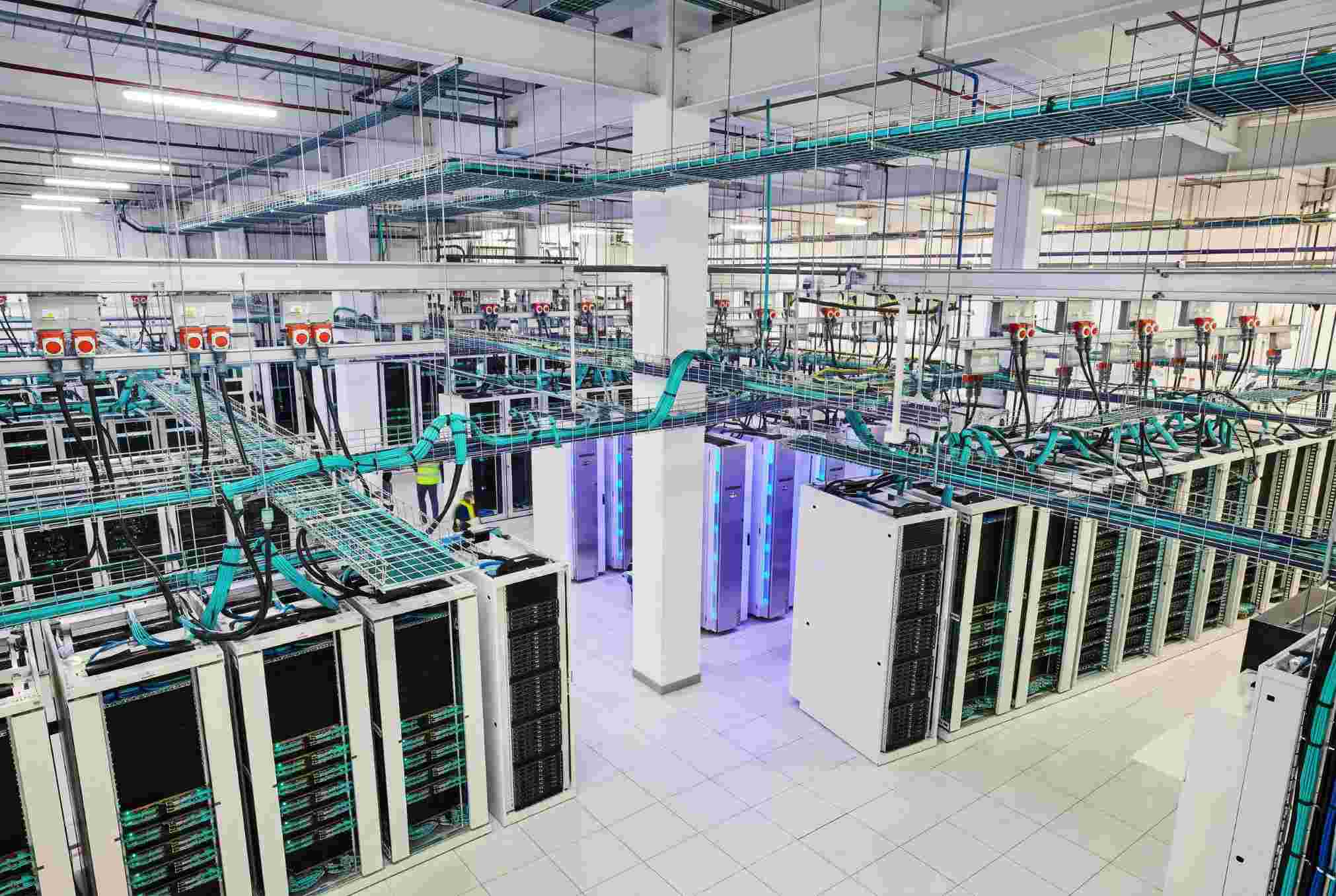 Data hall with closed-loop liquid cooling from a bird's eye view.