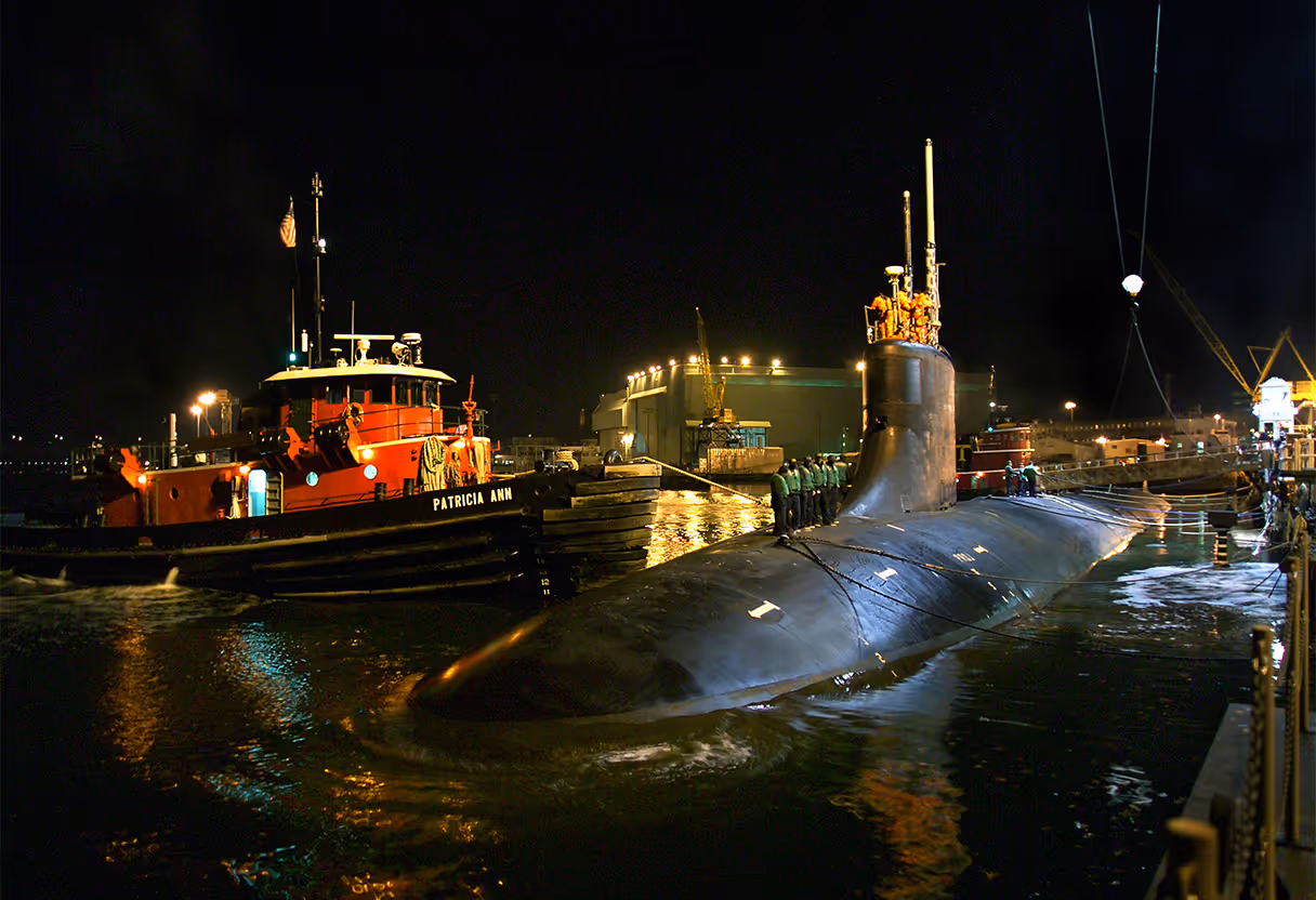 image of a volunteer mentoring teenagers in a tech workshop