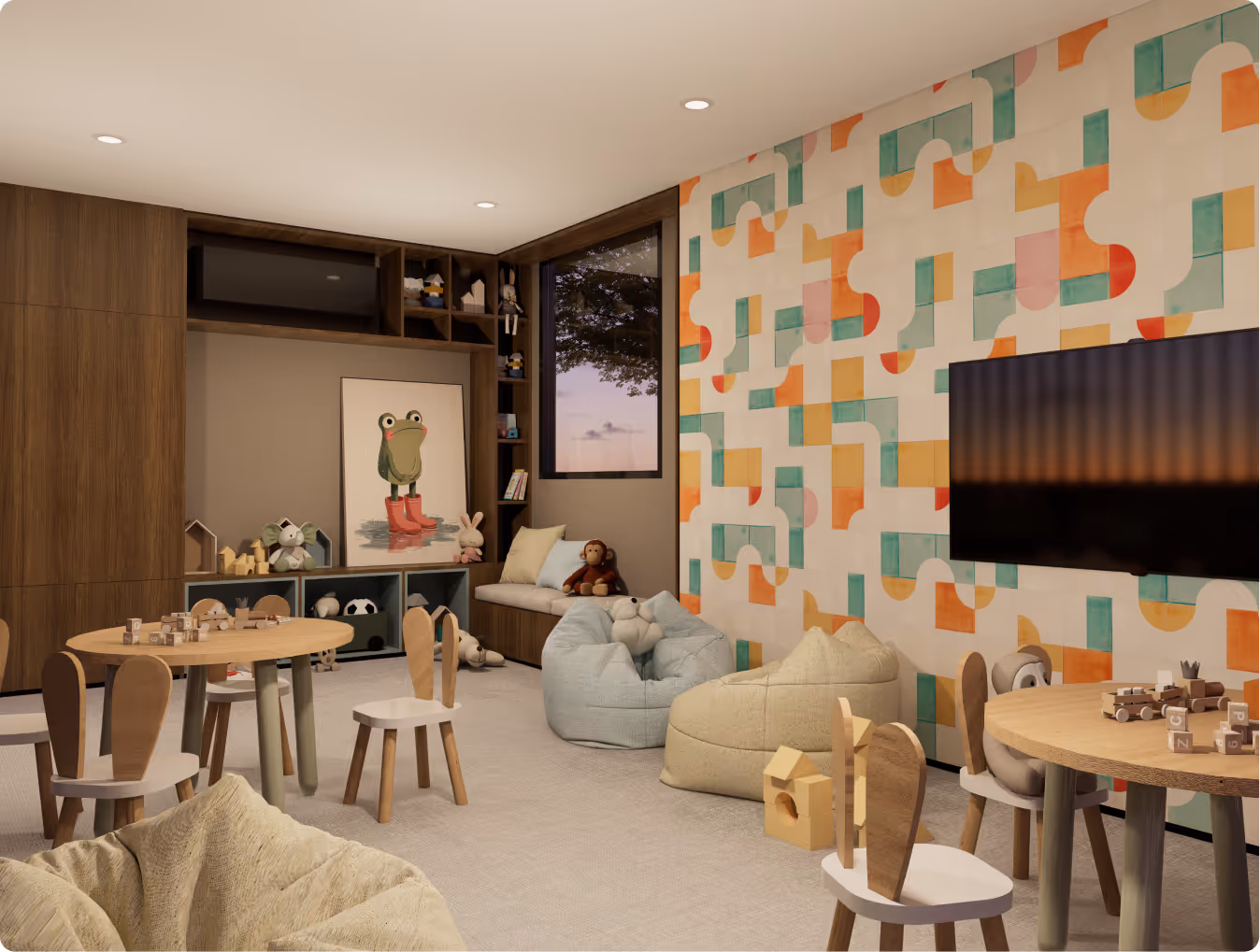 Children's playroom with colorful geometric wallpaper, wooden tables and chairs, bean bags, stuffed toys, and a wall-mounted TV.