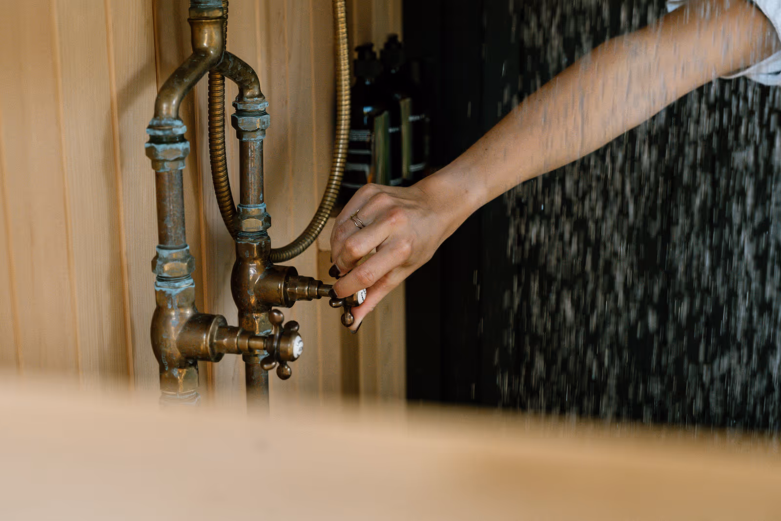 Morning sun rising over an outdoor sauna with louvres