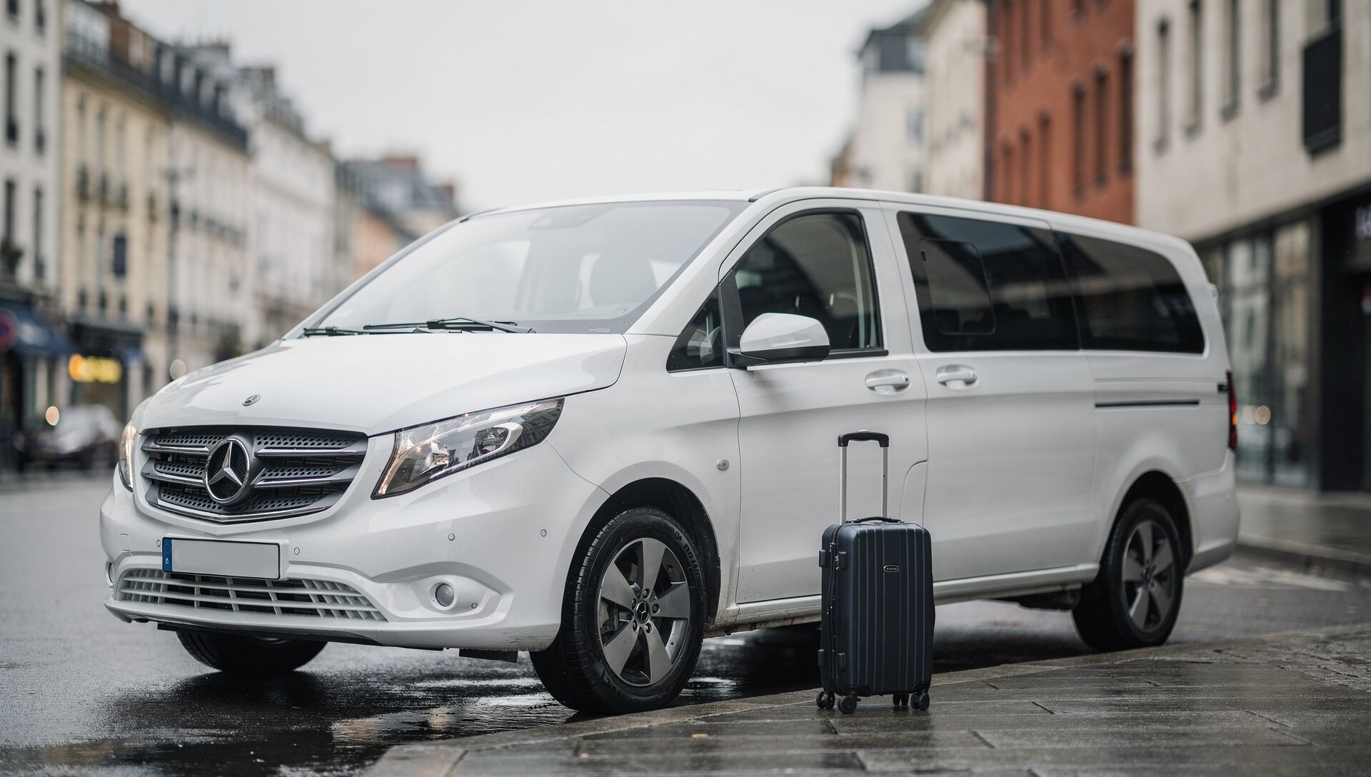 Mercedes Vito private transfer vehicle waiting for passengers on calm city street