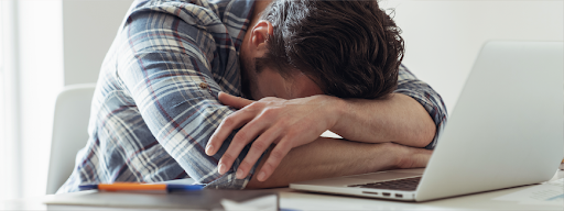 Man resting head on arms