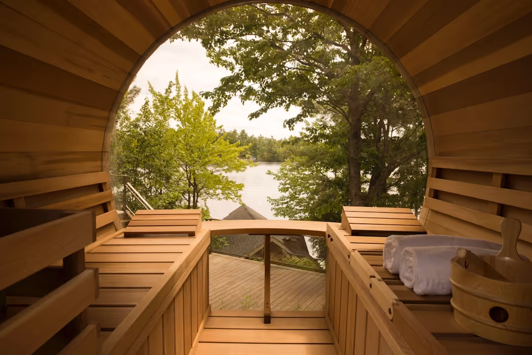View from inside a panoramic cedar sauna looking out