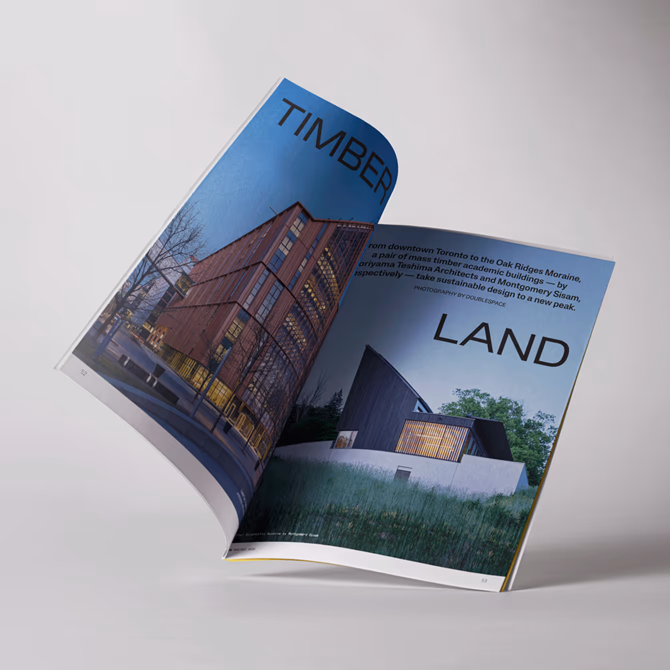 Open magazine showing architectural photos of modern timber buildings titled 'Timber Land'.