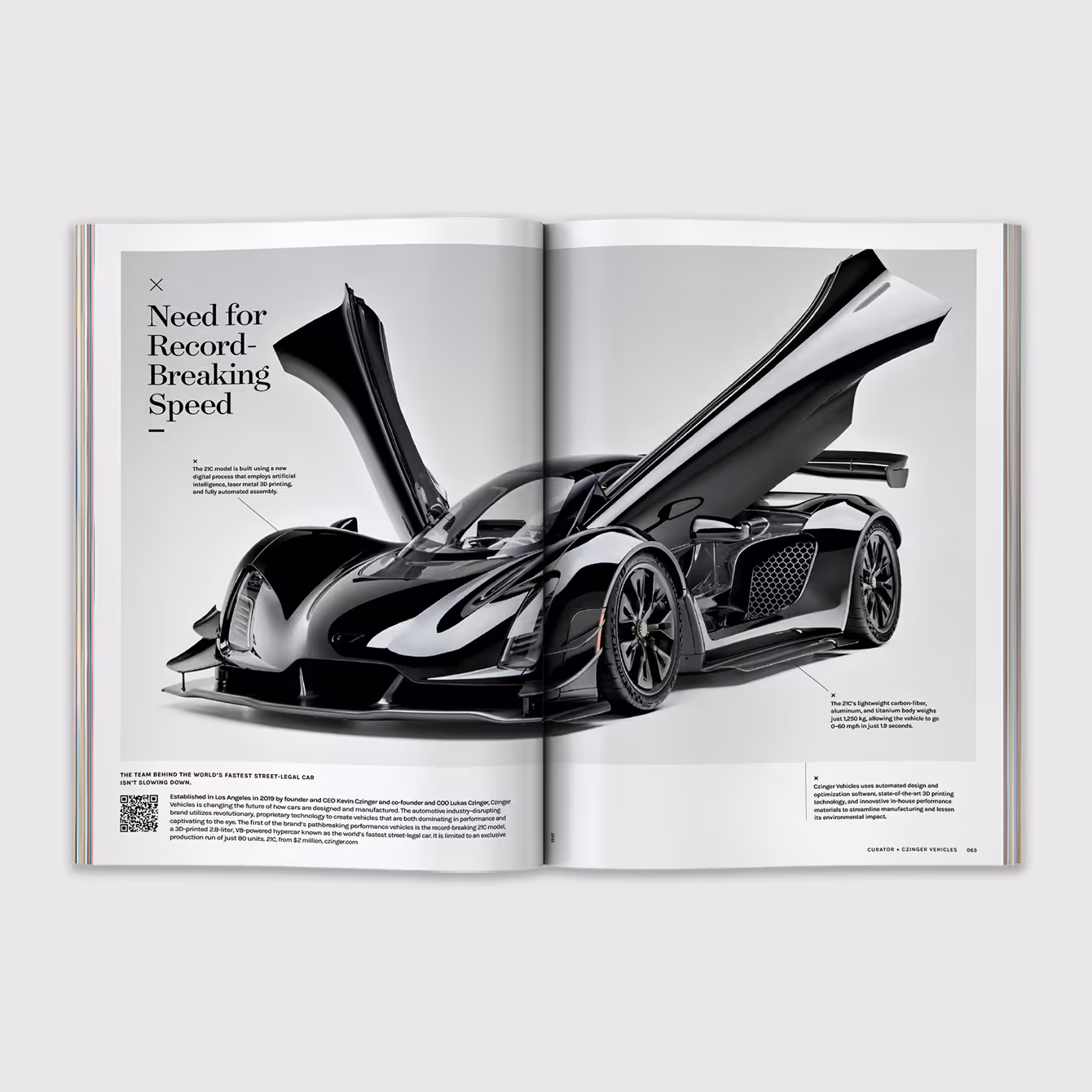 Magazine spread featuring a sleek black hypercar with butterfly doors open, highlighting its aerodynamic design.