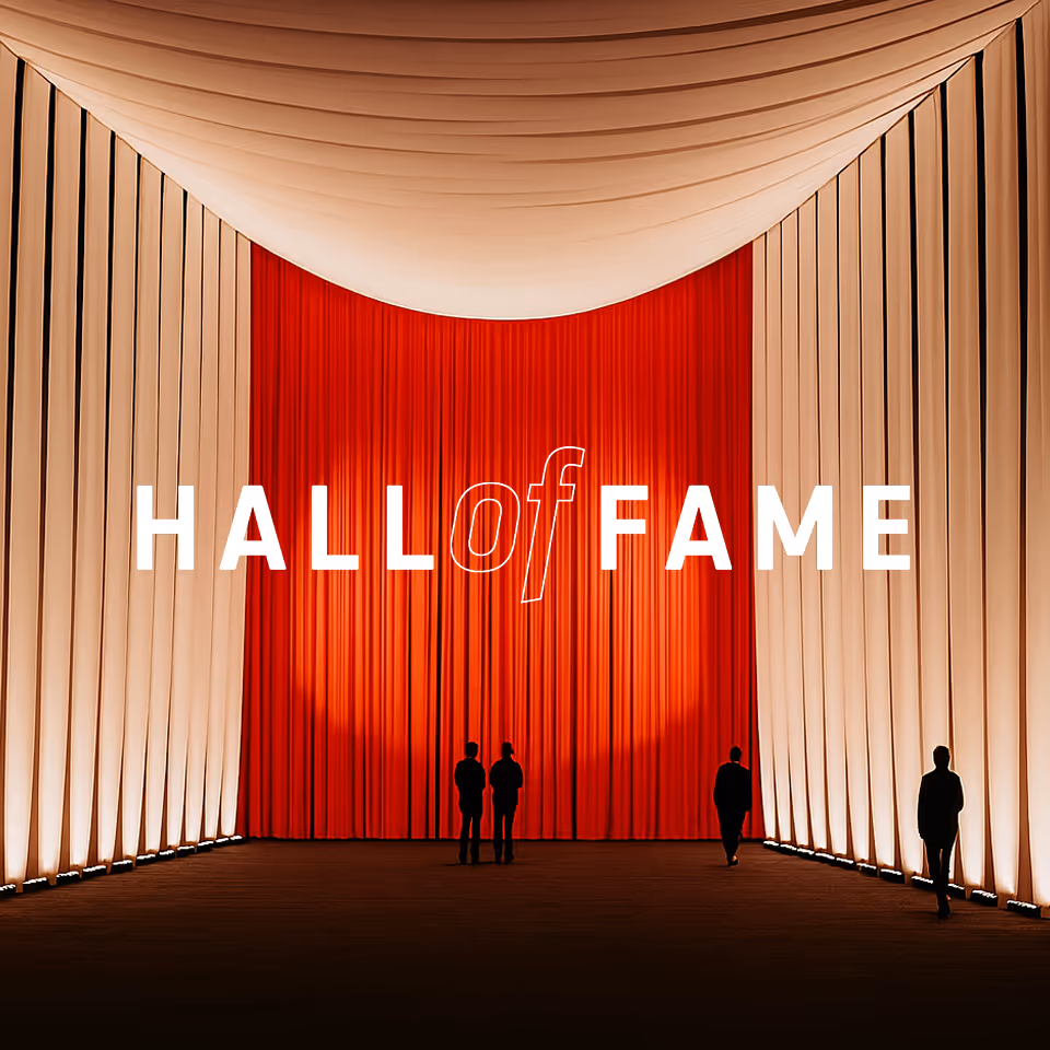 Silhouettes of four people standing in a grand hall with illuminated beige walls and red curtains, text reading 'HALL of FAME' overlayed.