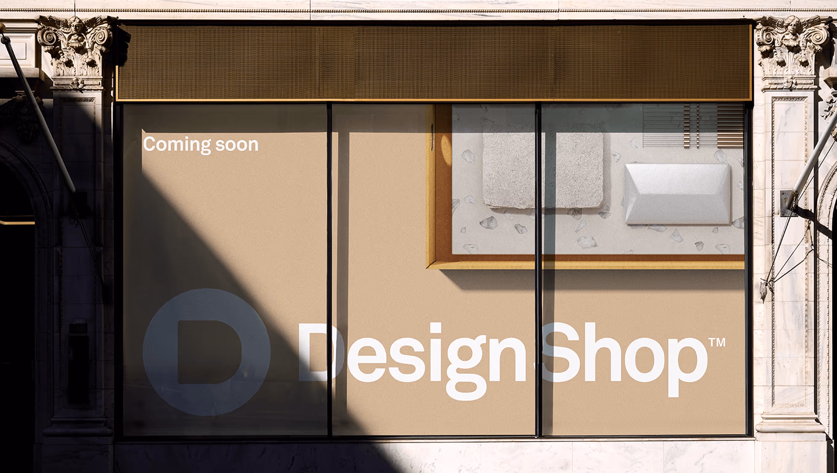 Storefront window with beige background and text reading 'Coming soon Design Shop™'.