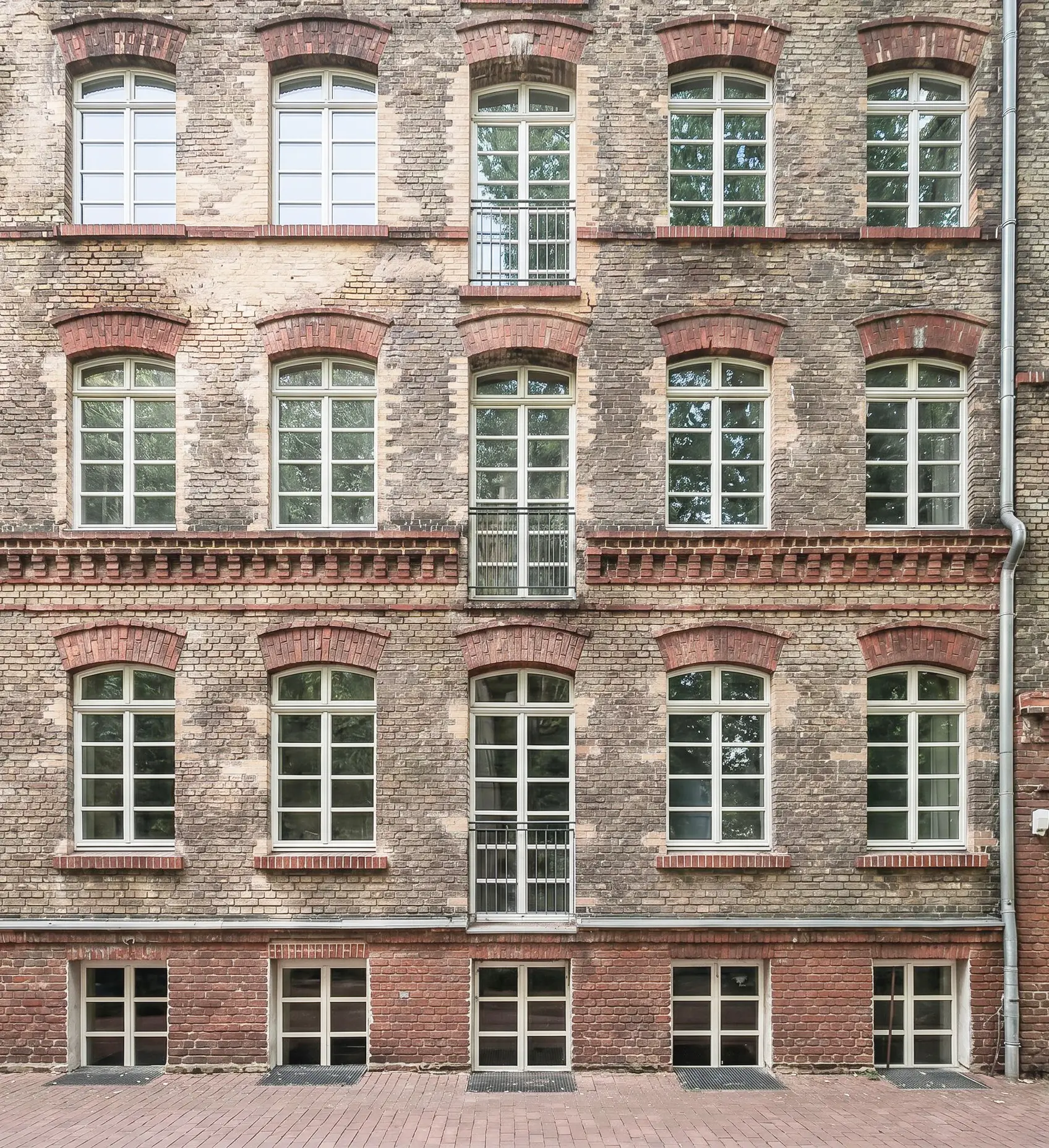 The historic brick facade of The Hinterhaus