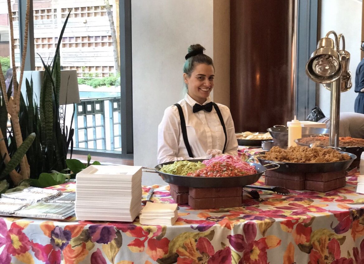 image of volunteers offering food at a harmoniously arranged ethereal canteen setting