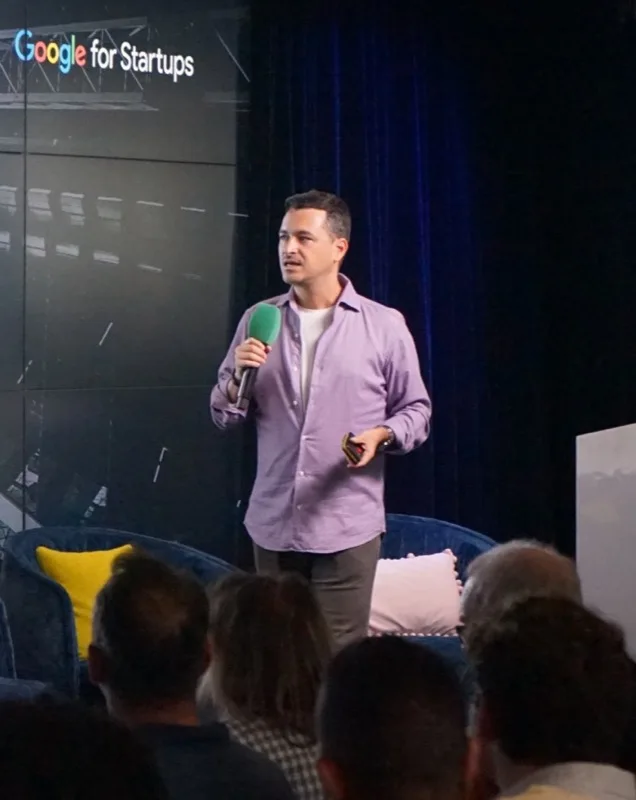 Alper Yurder speaking on stage at Google for Startups