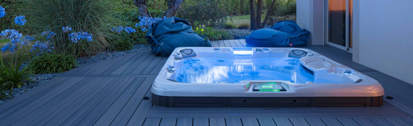 Sundance hot tub dropped into a large deck