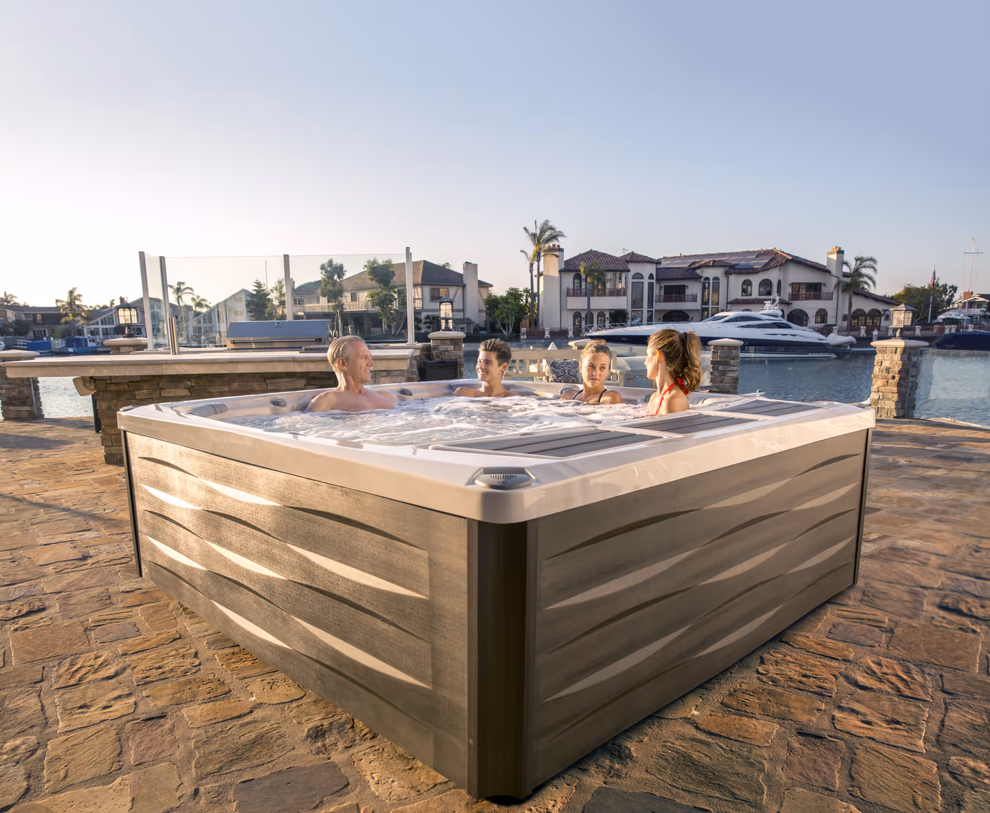 a family in a large hot tub