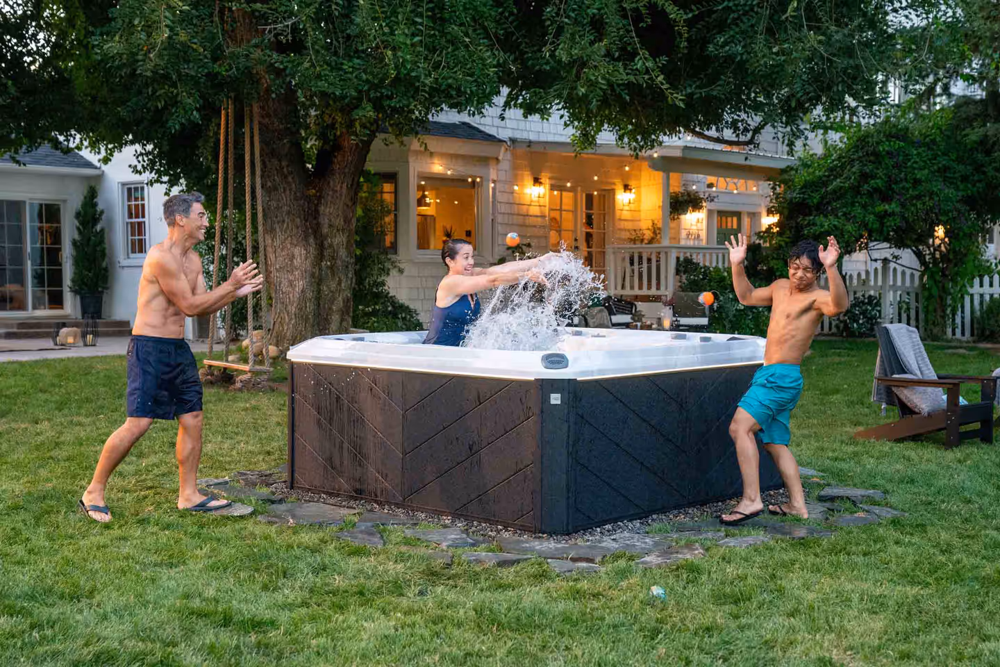 family splashing in hot tub