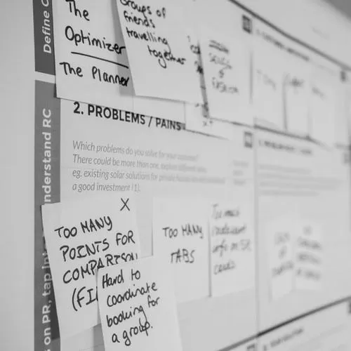 a bulletin board with several notes attached to it