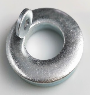 Two metal washers stacked, one smaller washer placed vertically on top of a larger flat washer.