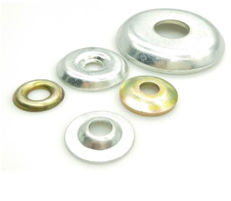 Five metal cup washers of varying sizes arranged on a white surface.