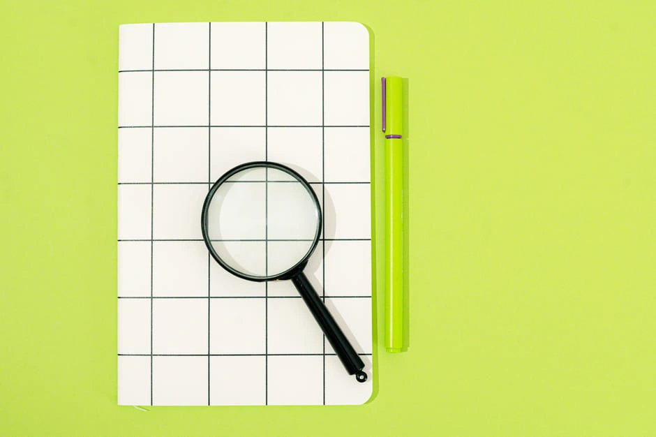 a checklist with a magnifying glass showing loan requirements a checklist with a magnifying glass showing loan requirements