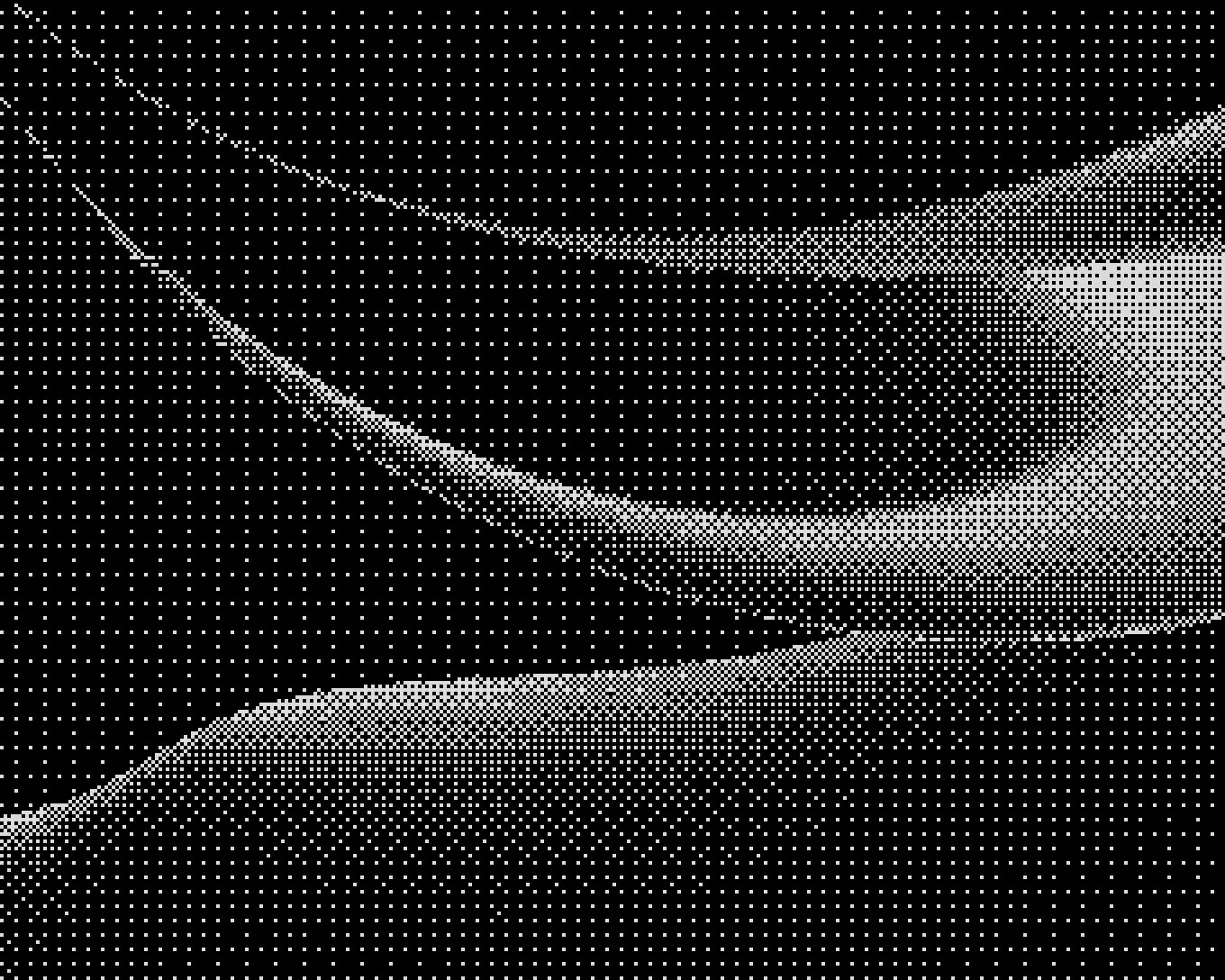 Indoor event setup with a small stage, a person working at a table with laptops, audio equipment, and a projector screen with blue curtains in the background.