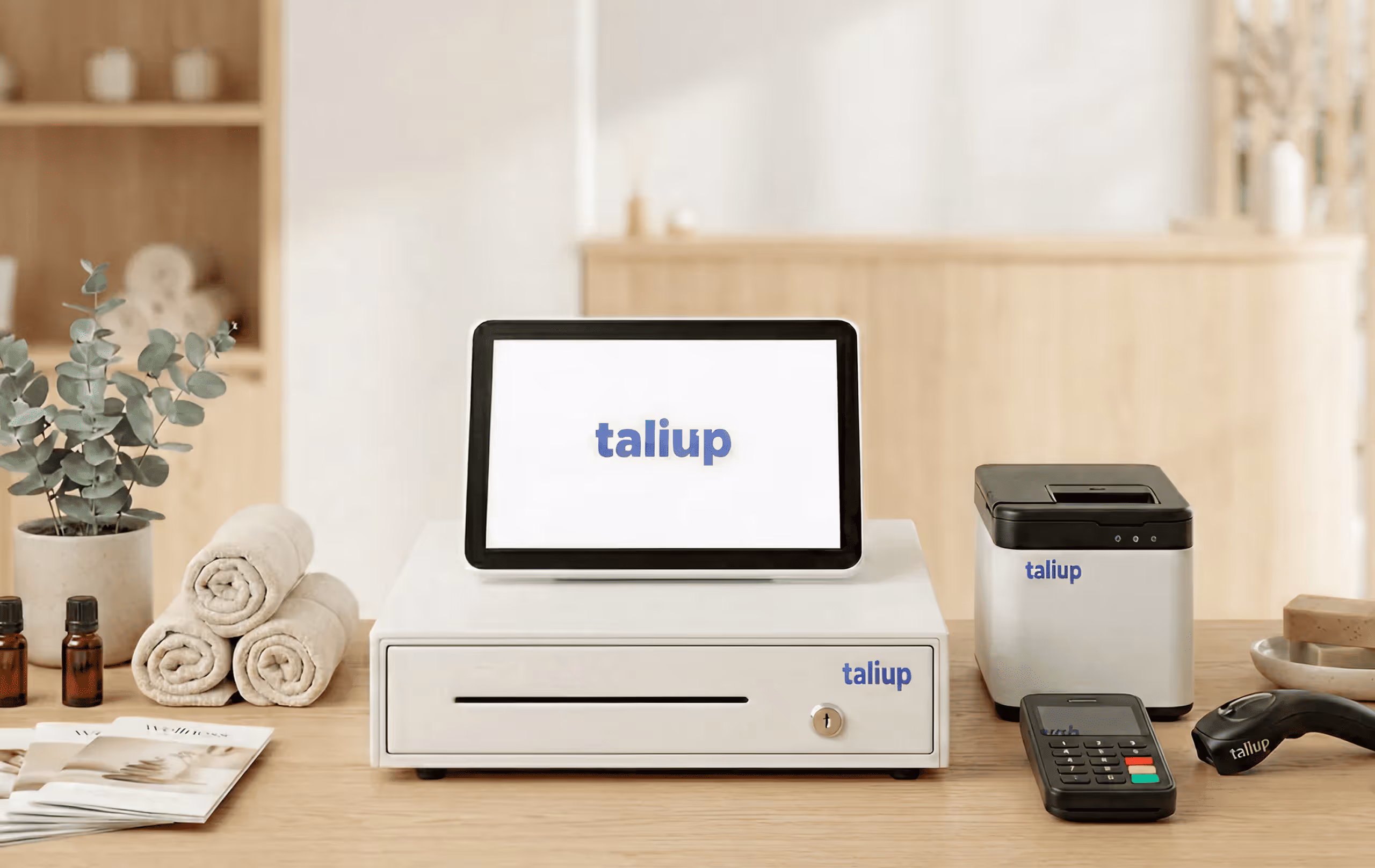 Point-of-sale system with touchscreen, cash drawer, receipt printer, card reader, and barcode scanner on a wooden countertop.
