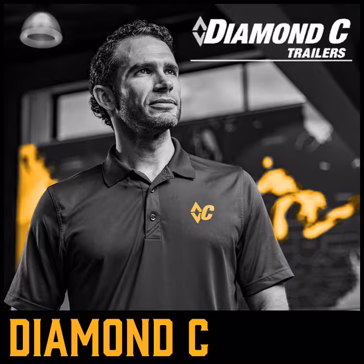 Man wearing Diamond C Trailers polo shirt looking thoughtfully upward 