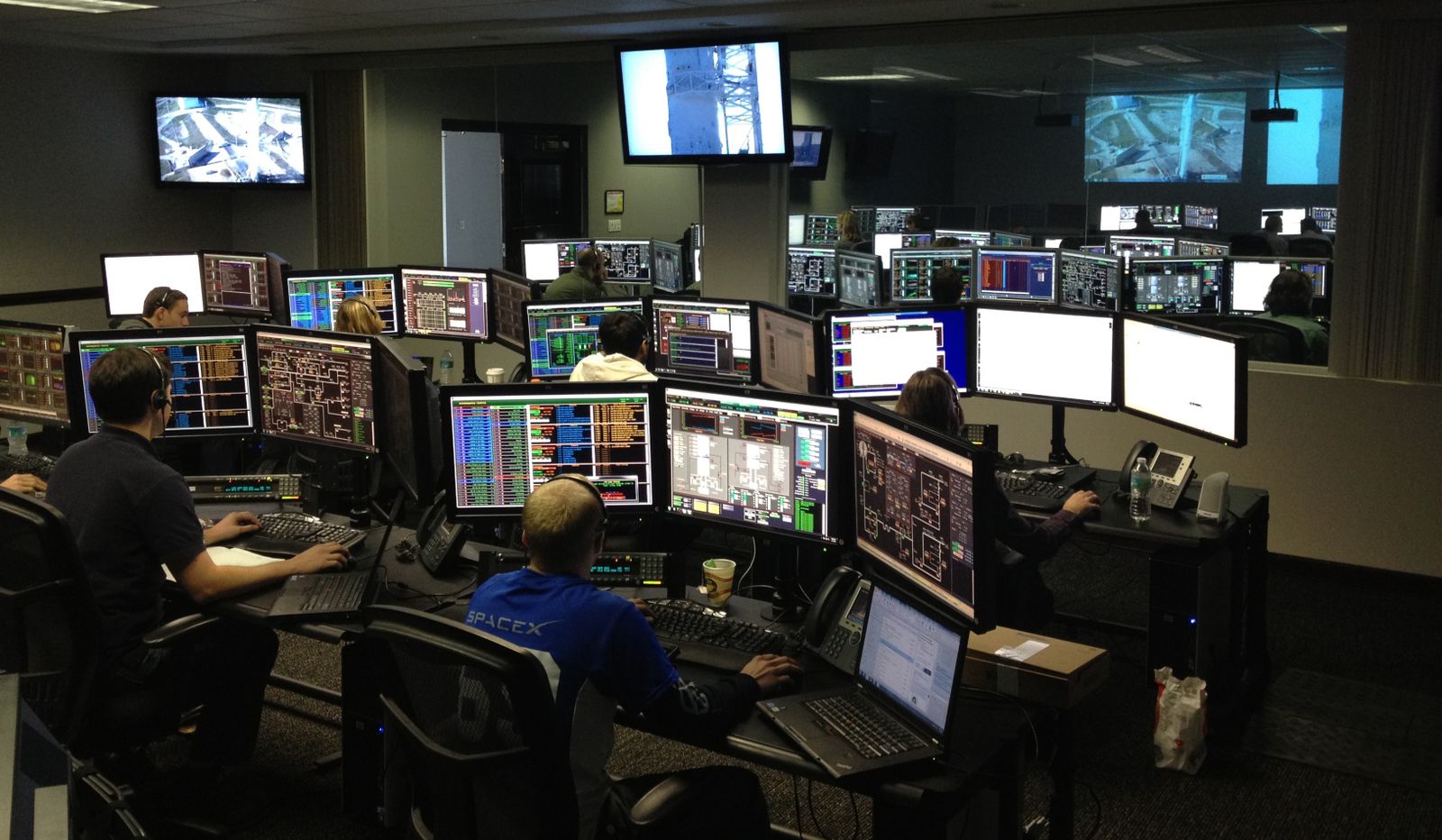 Software engineers implementing at their workstations