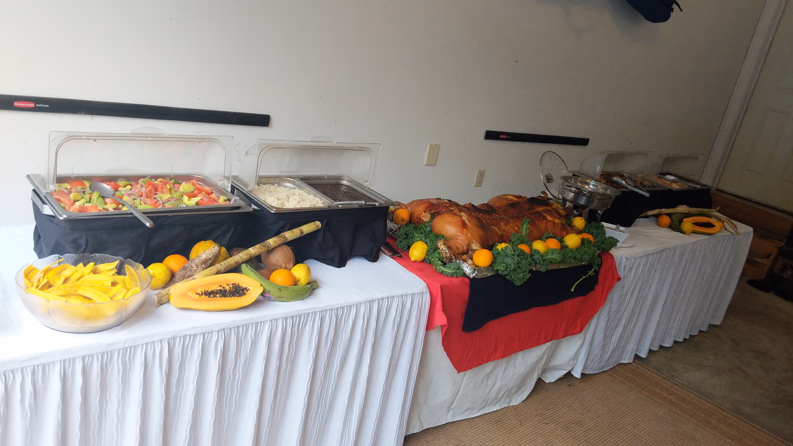 Cuban food catering buffet setup in a private home garage