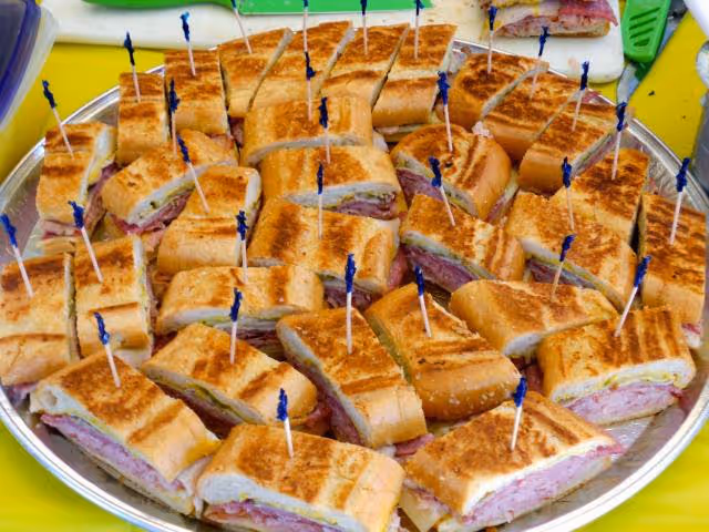 A tray of Cuban sandwiches delivered to an event