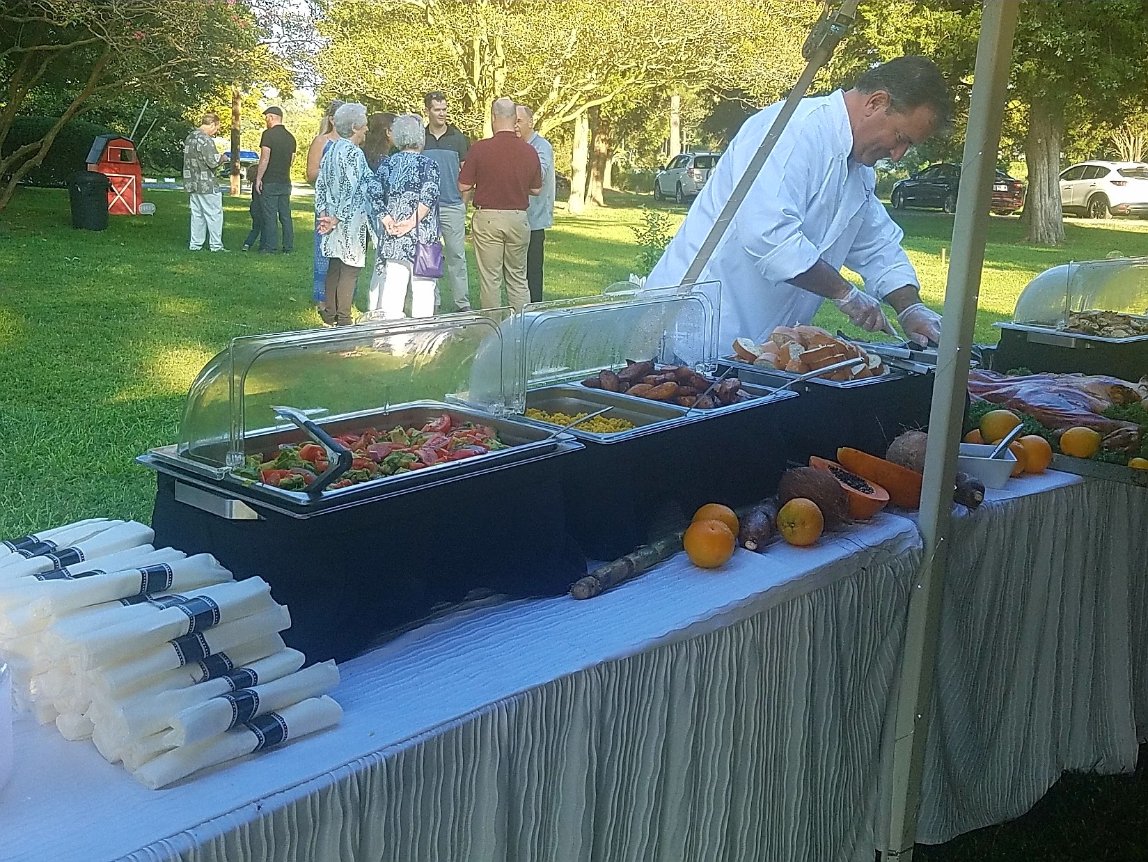 Chef prearing Cuban food catering buffet at private home event