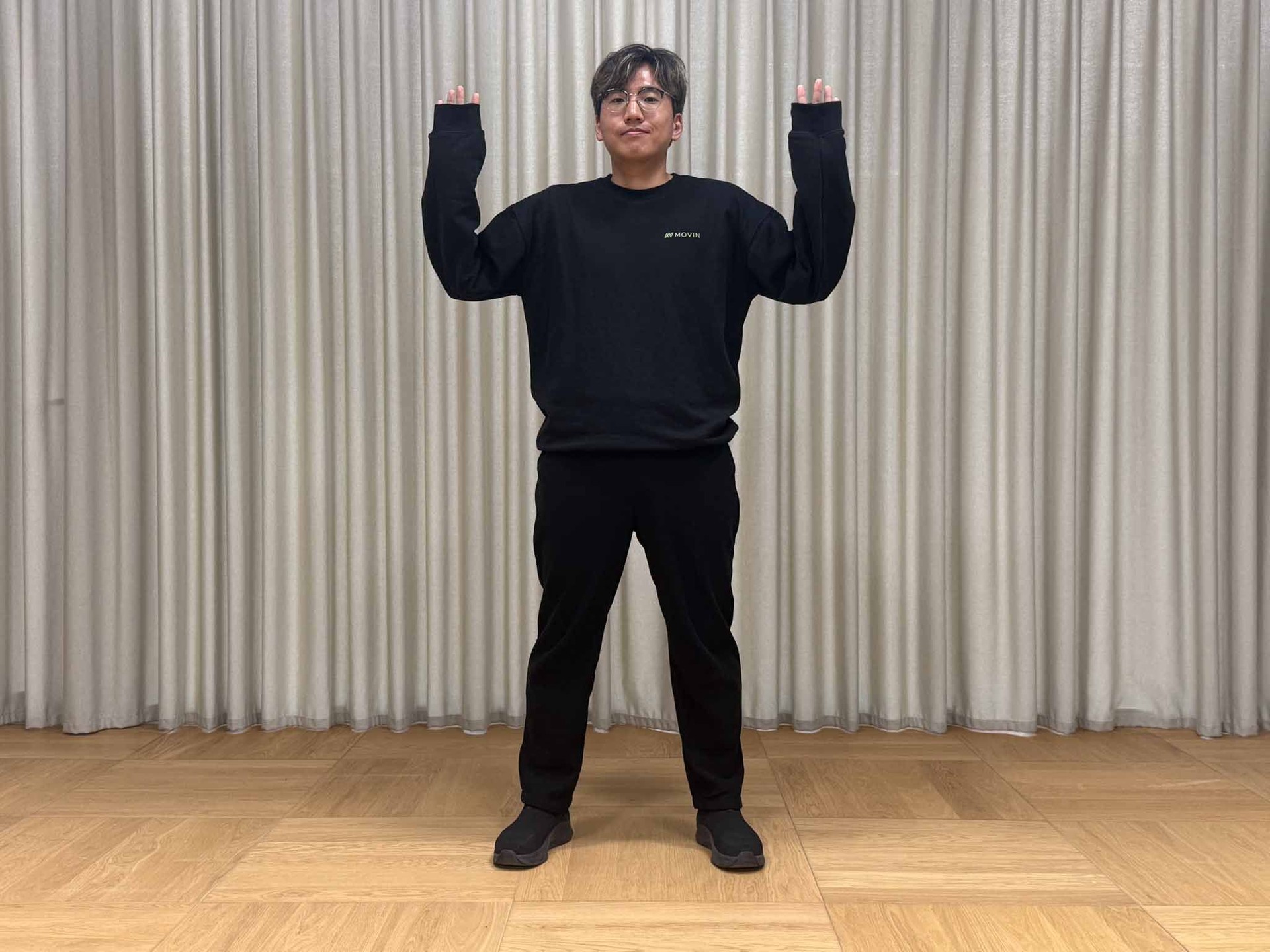 Wrists hidden by long sleeves