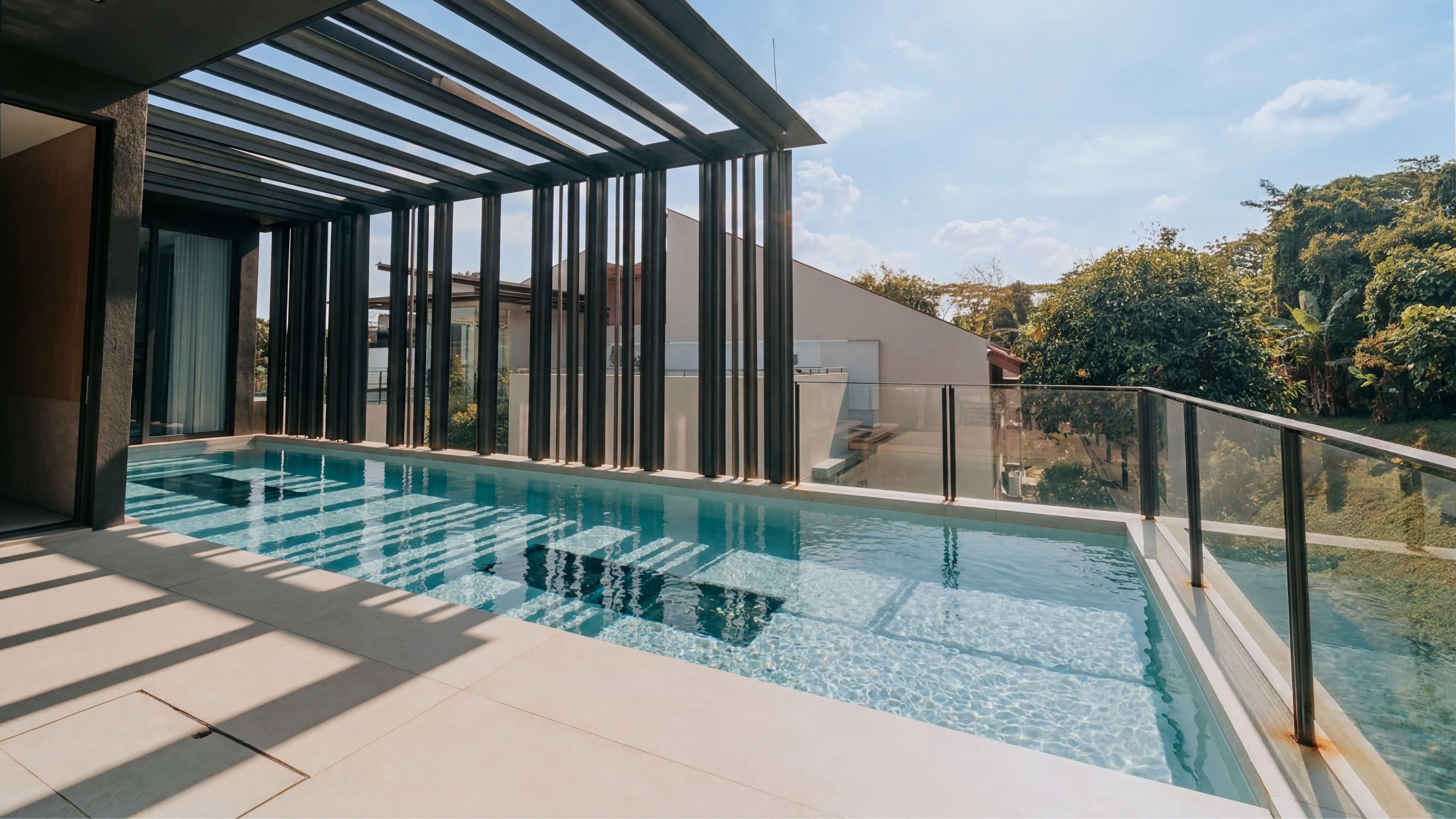 Private residential pool in Singapore constructed by Innovez Engineering in stainless steel. See-through underwater windows have been built onto the pool floor.