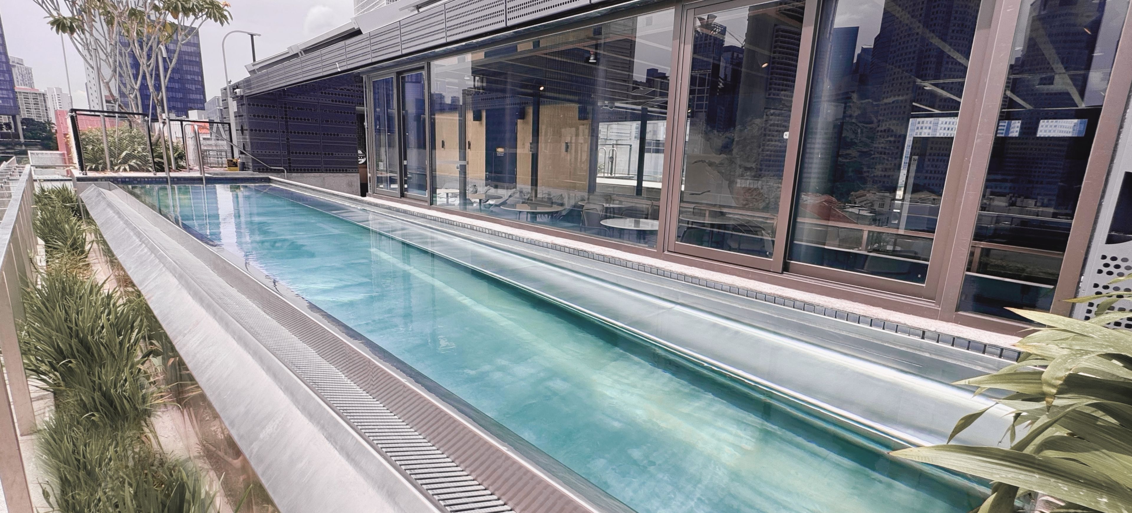 Stainless steel rooftop pool lap pool at 21 Carpenter hotel in Singapore.