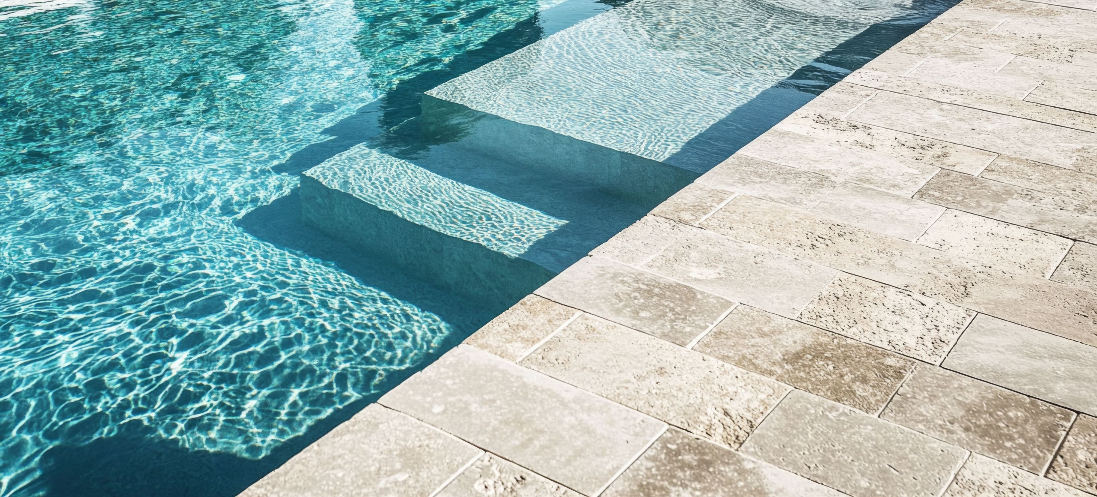 Beautifully carved steps lead down into a stainless steel pool. The tiles are all clean and new.