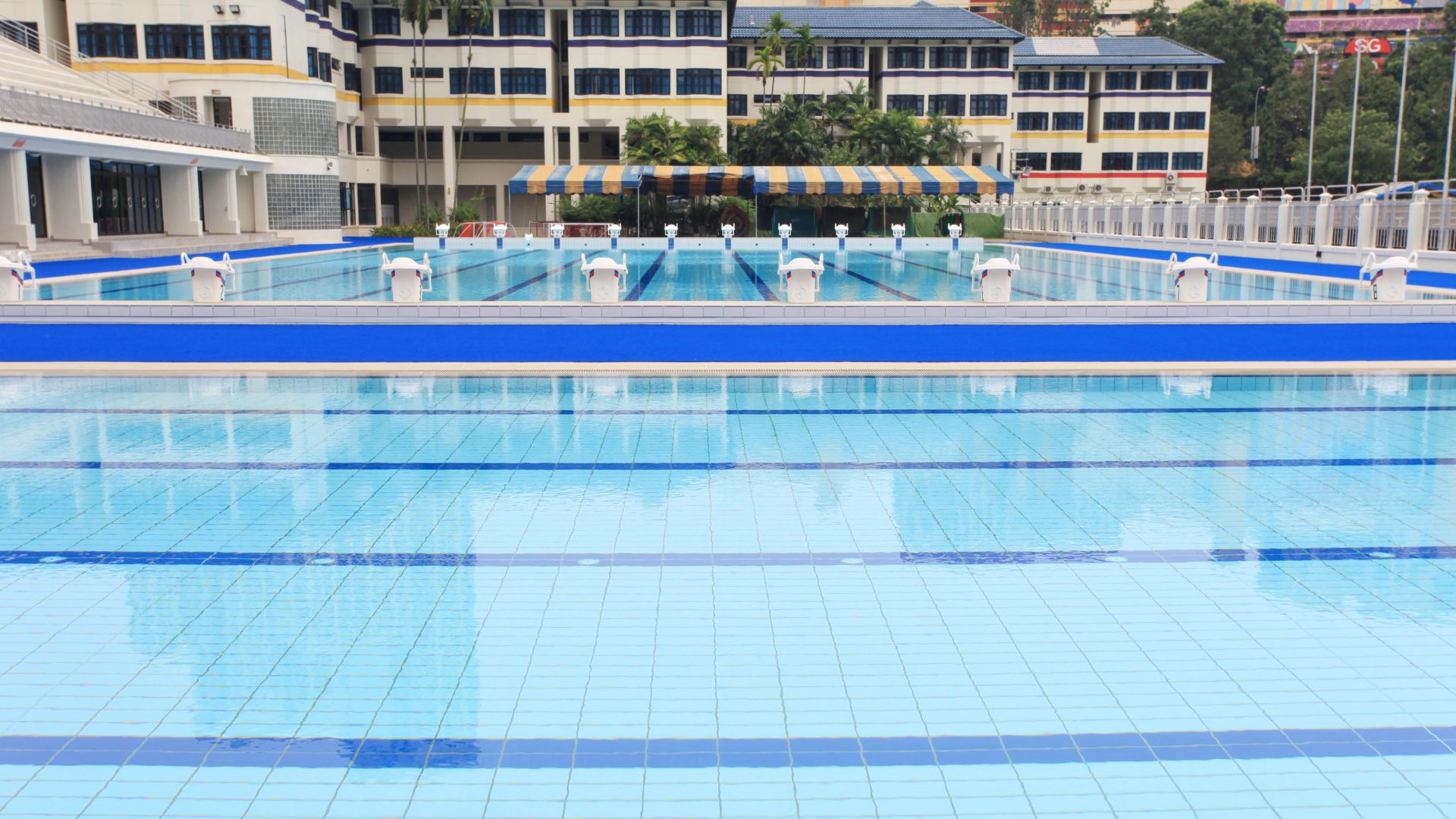 Eye-level view of the training and competition pools at Anglo-Chinese School Independent in Singapore. 