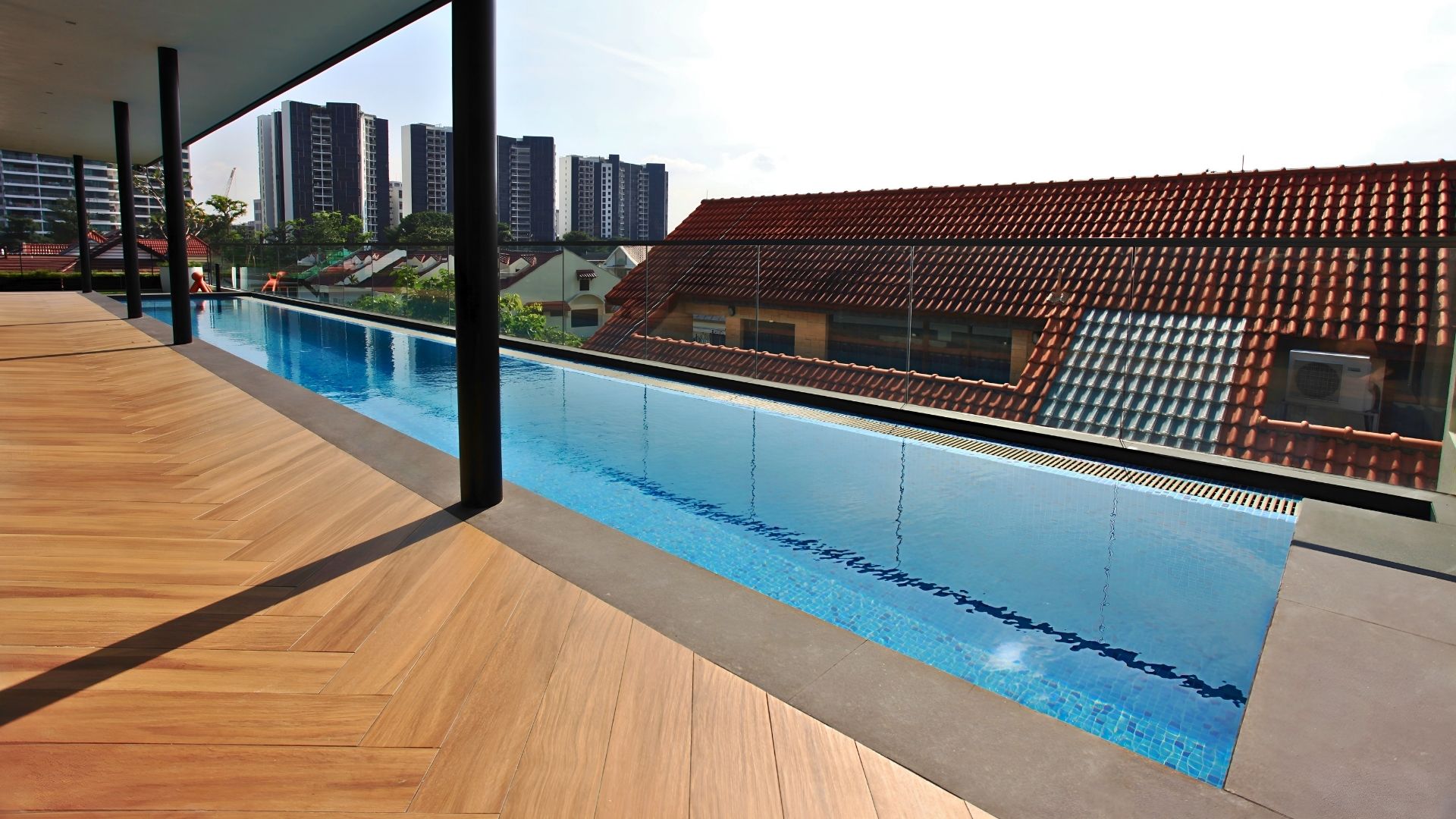 The full length of the stainless steel rooftop lap pool at a private residence in Singapore, designed and built by Innovez Engineering.