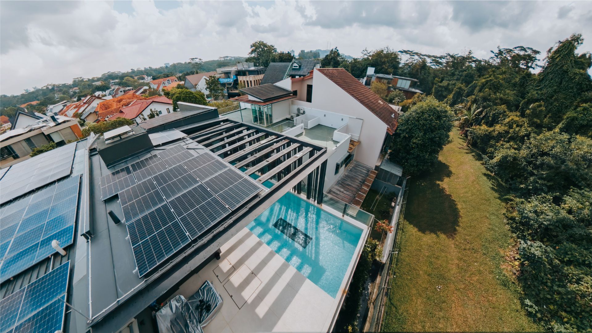 Full overhead view of a private landed property in Singapore, where an outdoor rooftop swimming pool with an underwater window is seen.
