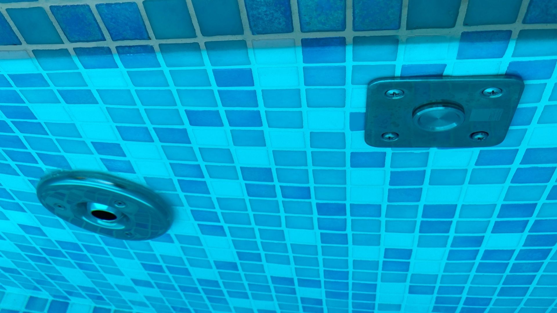 Underwater close-up of the stainless steel jacuzzi features of a private residential's swimming pool in Singapore.