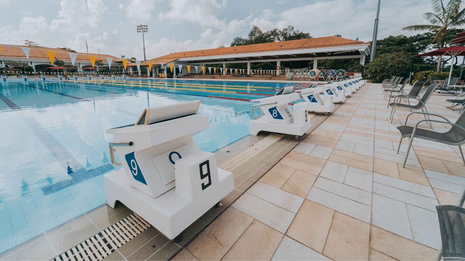 Close-up of the numbered starting blocks at the Singapore Island Country Club competition swimming pool.