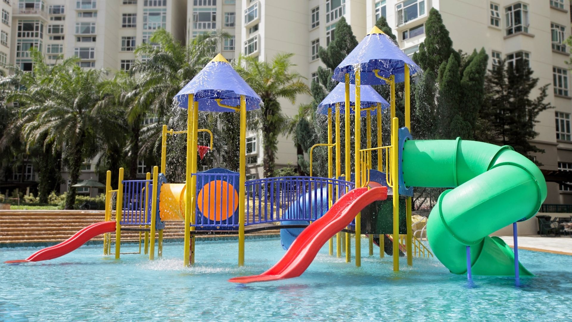 The upgraded wet playground at Summerhill Condominium in Singapore. It is complete with various water slides, tunnels, and other fun water features.