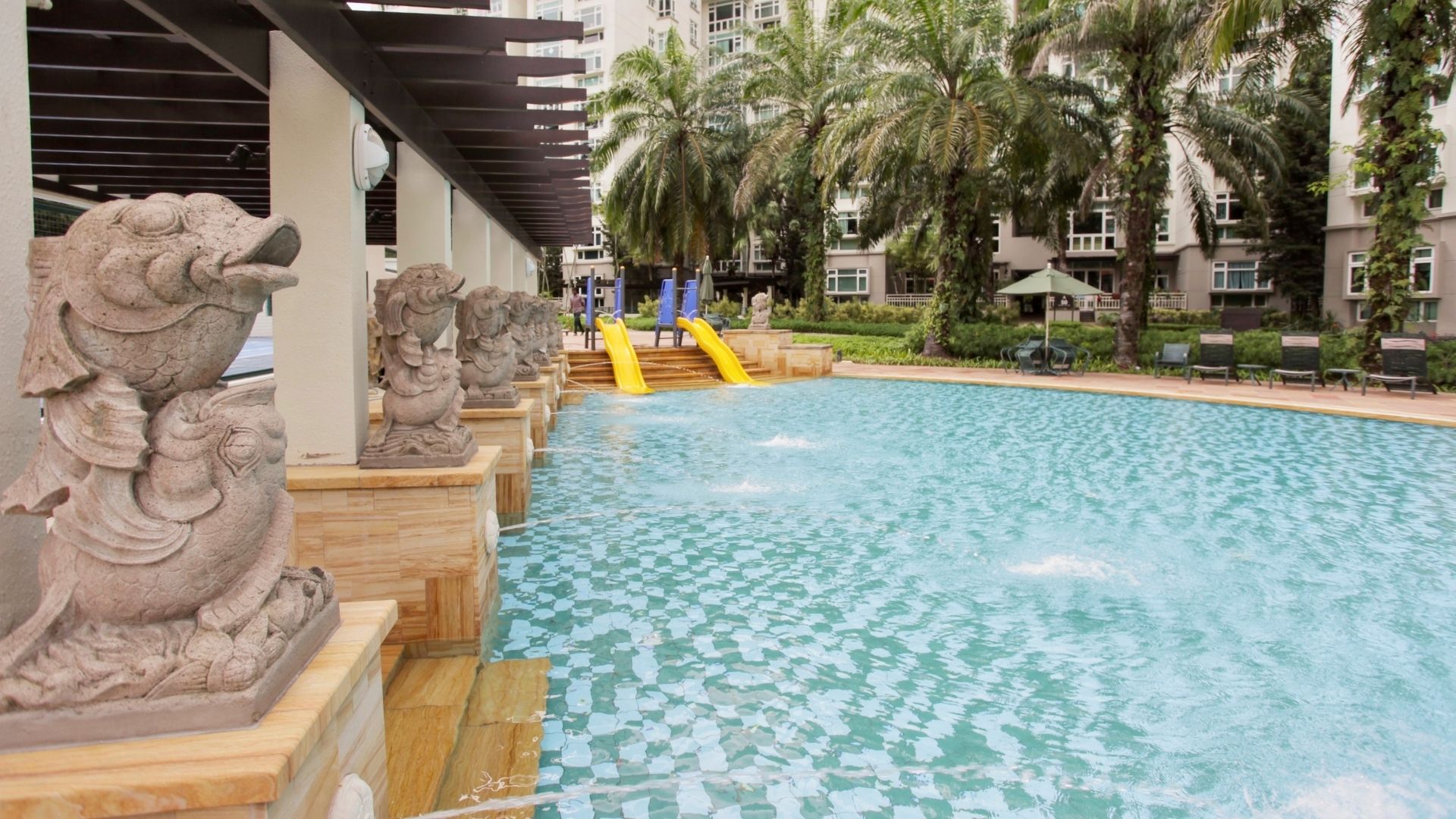 The swimming pool at Summerhill condominium in Singapore, complete with wet slides and water features.