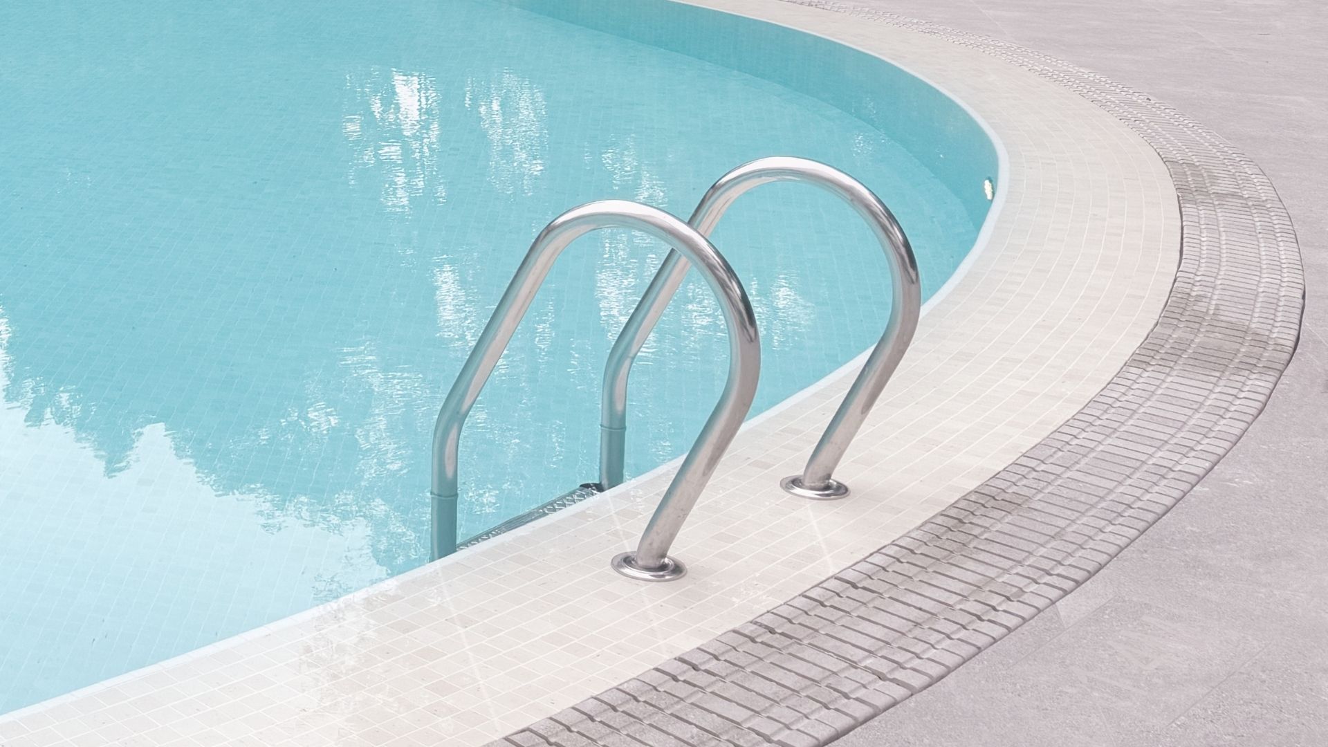 Close-up of the stainless steel swimming pool ladder at The Arcadia Condominium in Singapore.