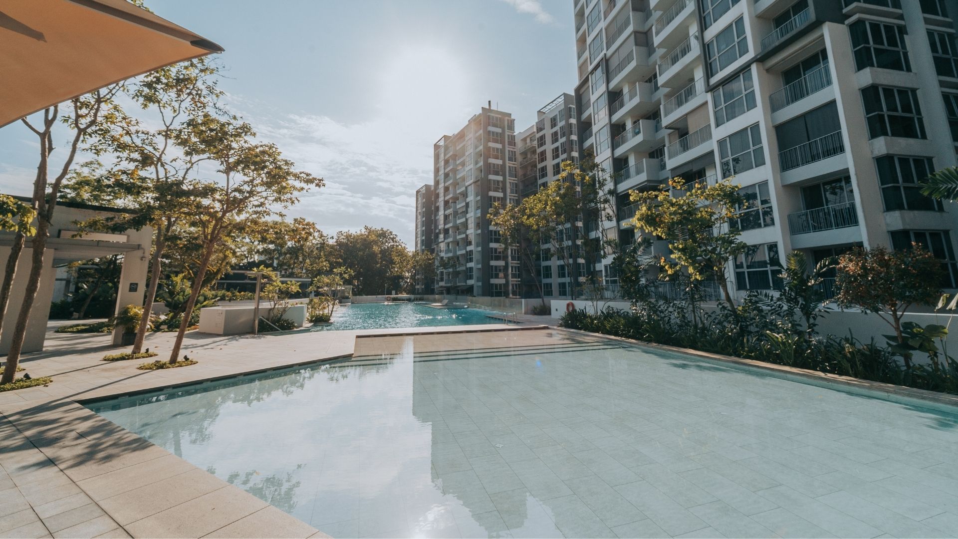 Ground-level view of the two swimming pools at The Estuary Condomium in Singapore, after renovation works have been completed.