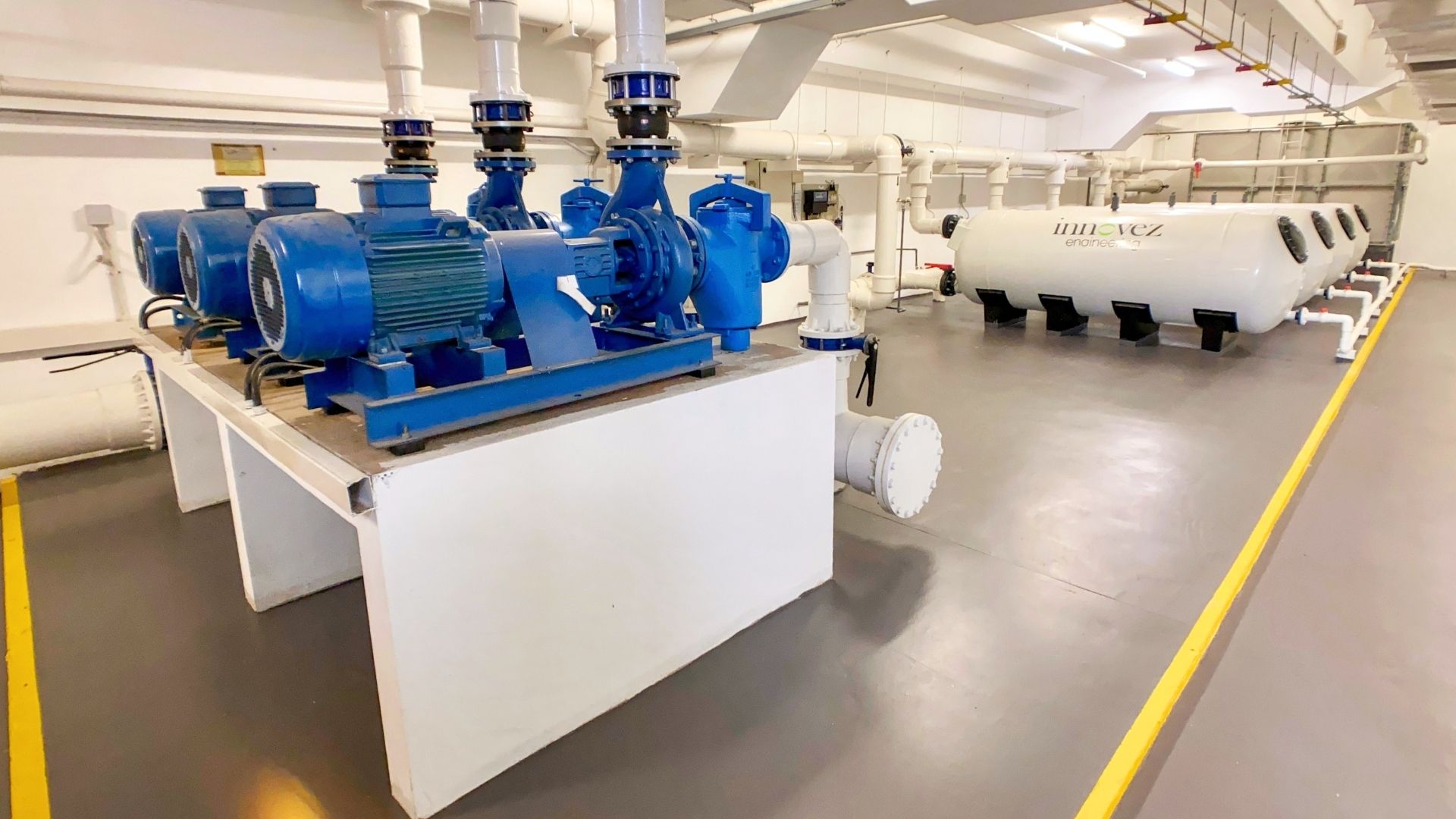 The upgraded pump room at the United World College Southeast Asia (UWCSEA East Campus) in Singapore, featuring new high-performance pumps, Innovez Engineering's high-rate sand filters, and an upgraded control panel.