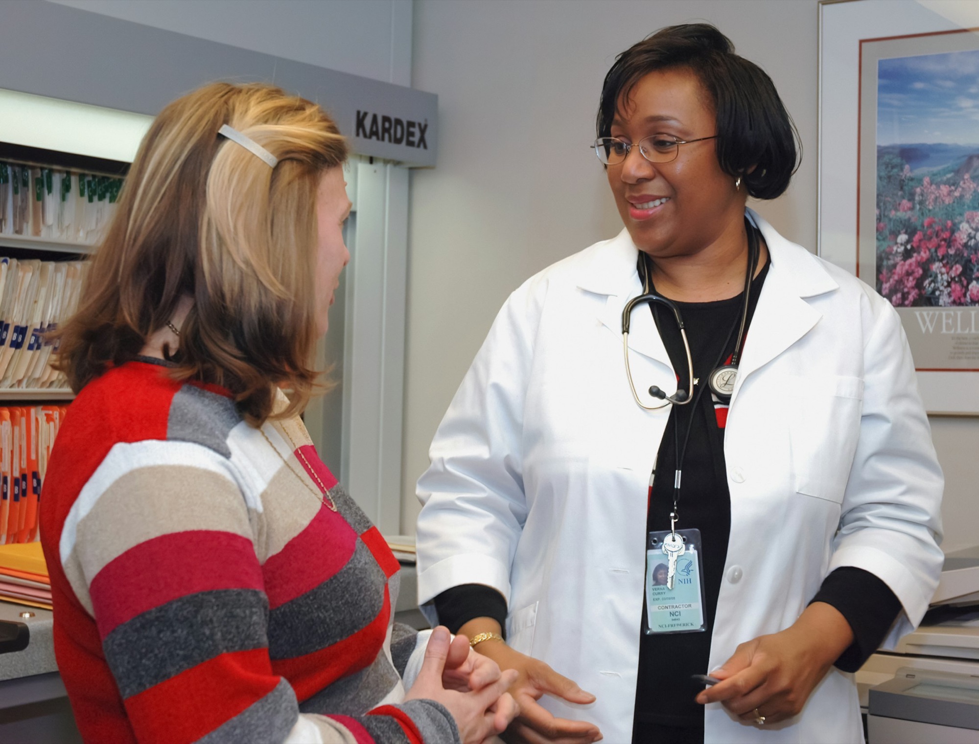 A clinician talking with a patient