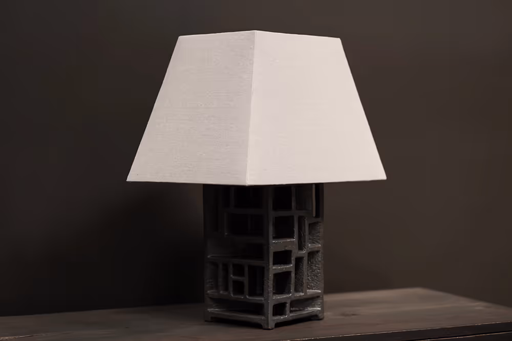 Ashlar Ceramic Lamp lit, warm light through lampshade