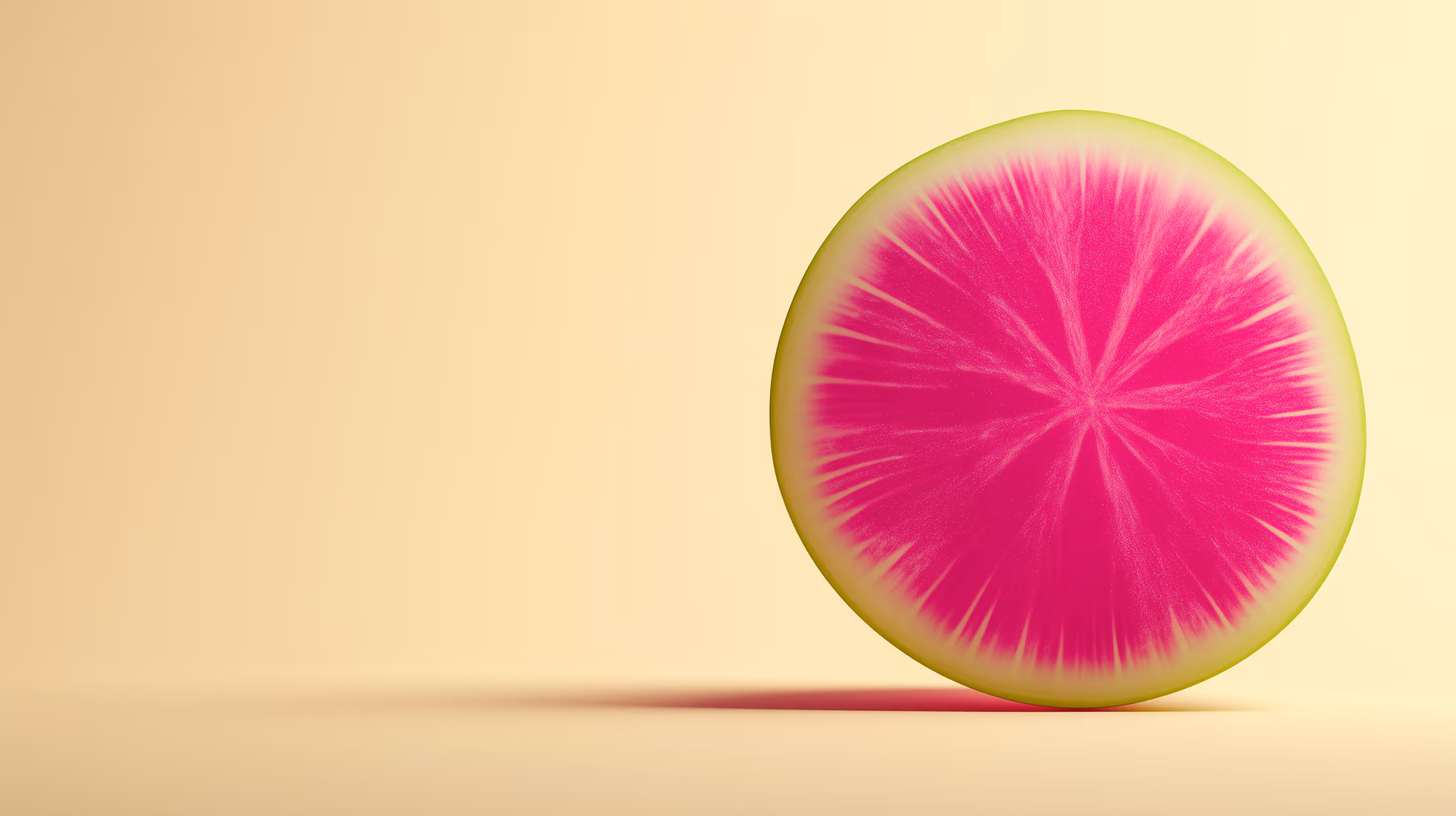 A vivid cross-section of a watermelon radish, showcasing its bright pink interior and green outer ring — a fresh, plant-based ingredient.
