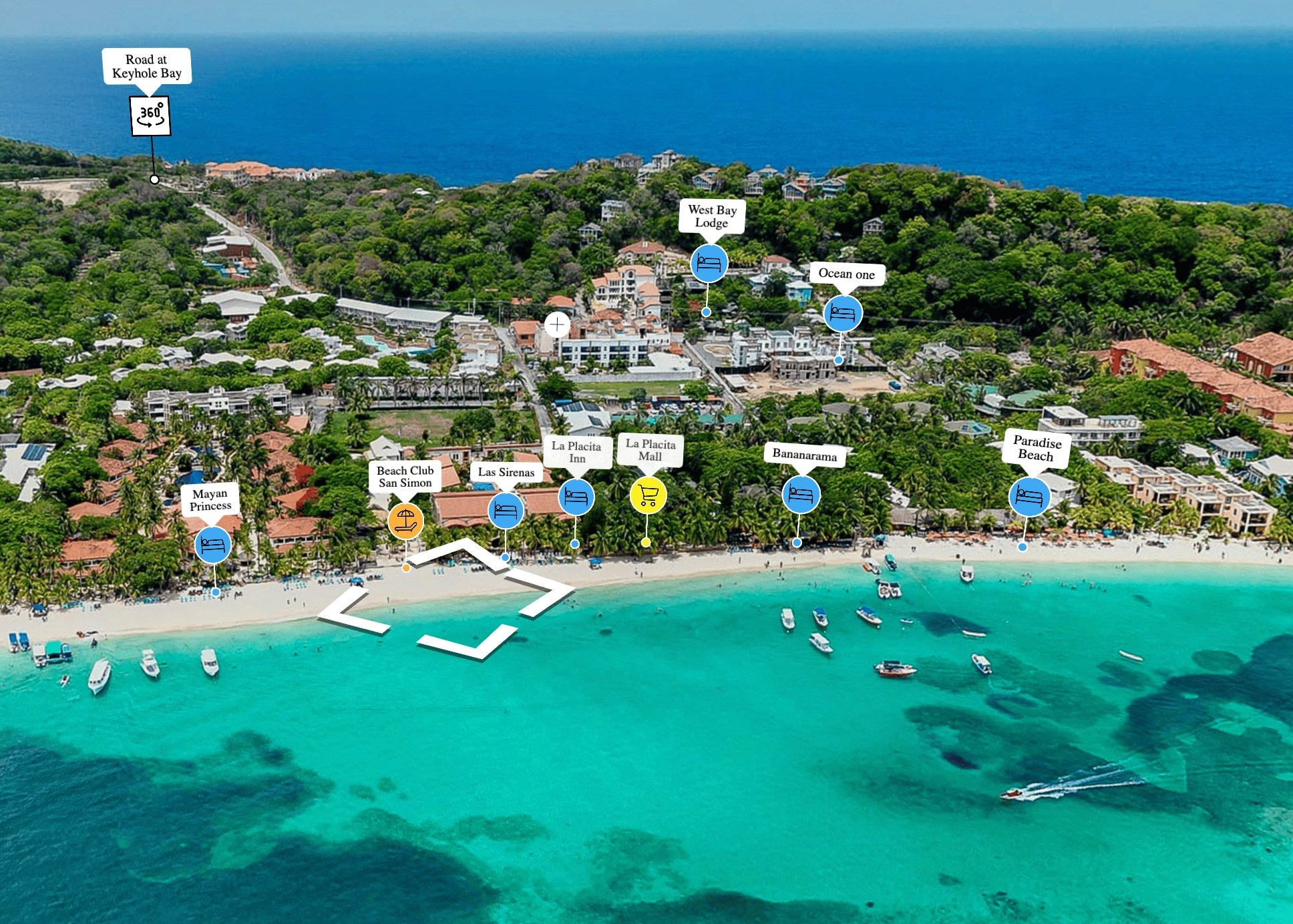 Aerial view of a tropical beach with turquoise water, white sand, boats near shore, and labeled accommodations and locations including Mayan Princess, Beach Club San Simon, Las Sirenas, La Placita Inn, La Placita Mall, Bananarama, Paradise Beach, West Bay Lodge, Ocean One, and Road at Keyhole Bay.