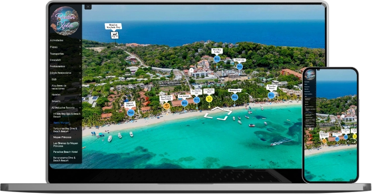 Laptop and smartphone displaying an interactive map of a coastal resort with labels for hotels, restaurants, and attractions along a turquoise beach and green forest.