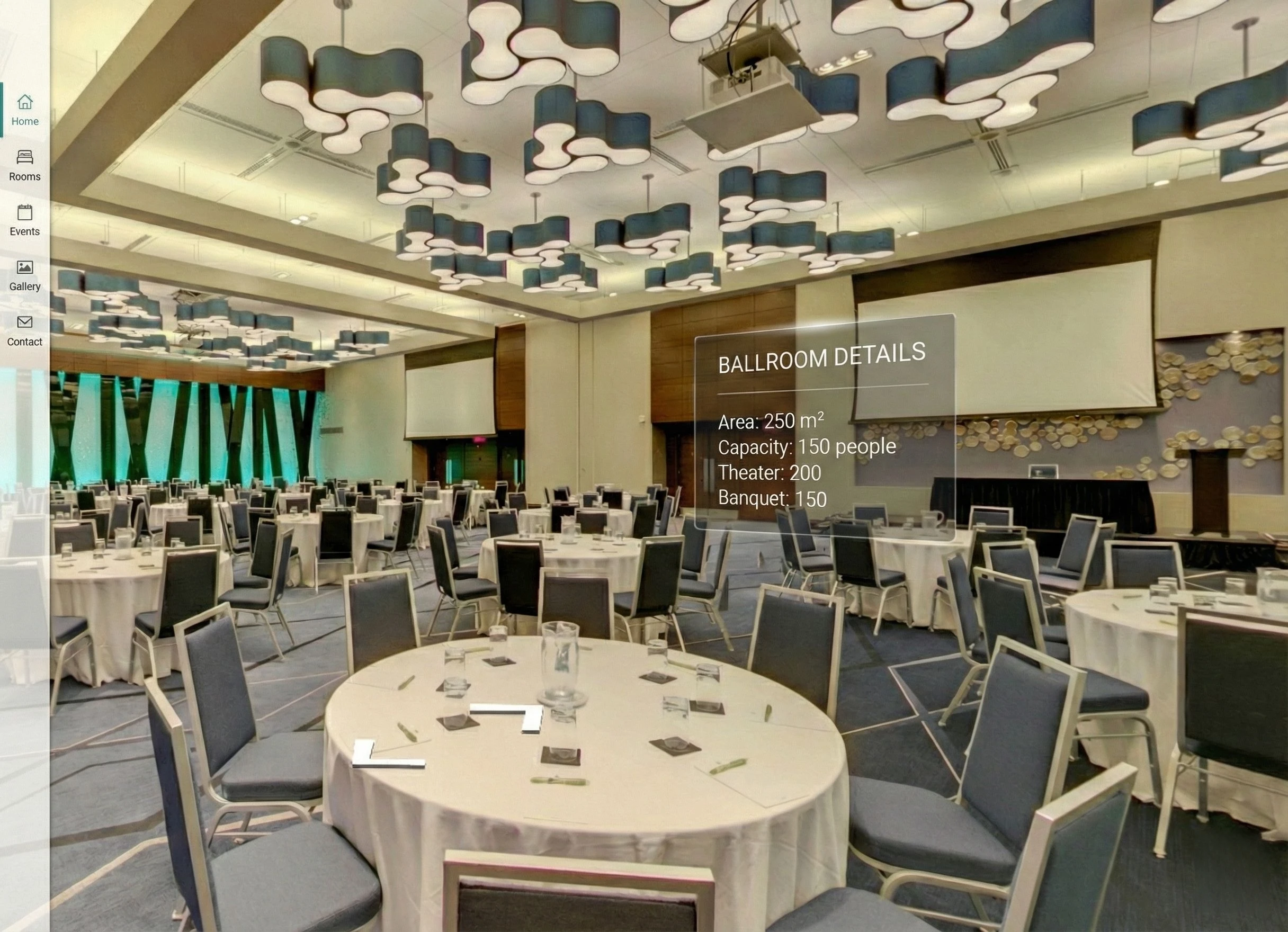 Large conference room with round tables covered in white cloths, surrounded by blue chairs, and modern ceiling lights.