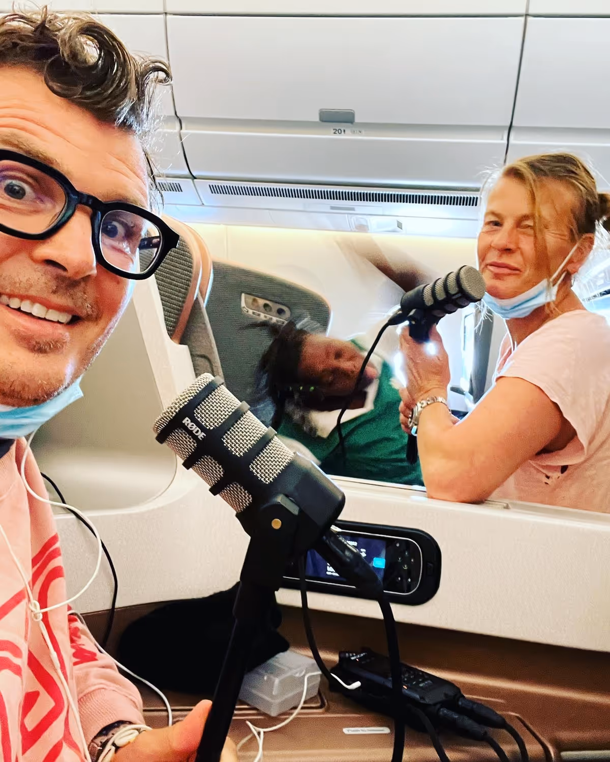 Pelle Hvenegaard with a microphone on an airplane