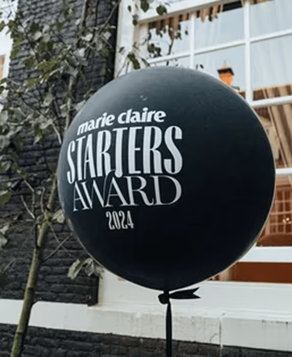 Zwarte ballon met Marie Claire Starters Award 2024 opschrift